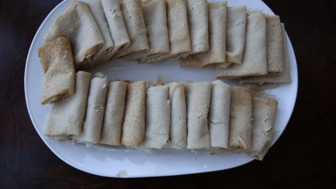 Kisra, individual kisra leaves folded for serving. South Sudanese food. Sudanese food.