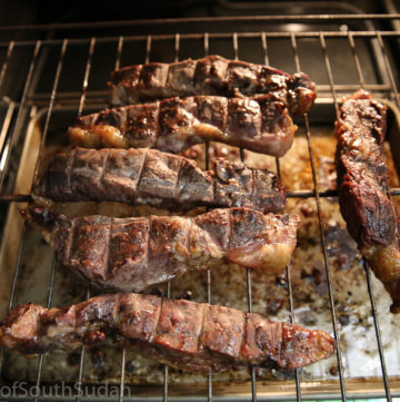 Pictured above are smoked meat in an oven. South Sudan food, Sudanese food, African food.