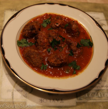 Picture above is kofta, spicy minced meatballs in tomato sauce. South Sudan food, Sudanese food, North African cuisine.