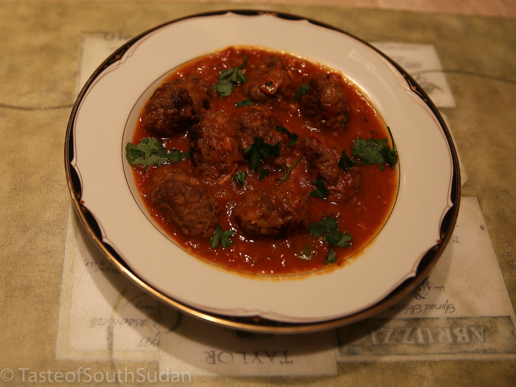 Picture above is kofta, spicy minced meatballs in tomato sauce. South Sudan food, Sudanese food, North African cuisine.