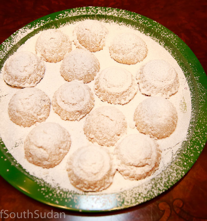 Kahk, filled with dates, dusted with icing sugar.