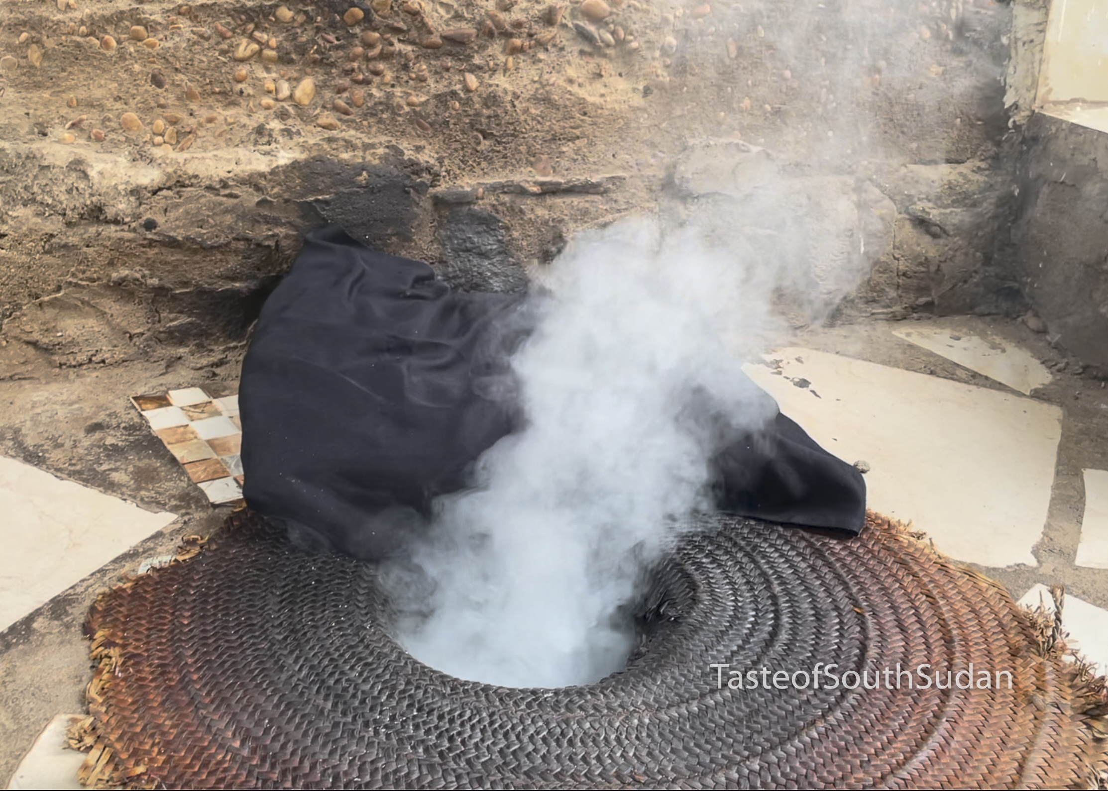 Dukhan smoke bath pit with the talih wood set to smoke